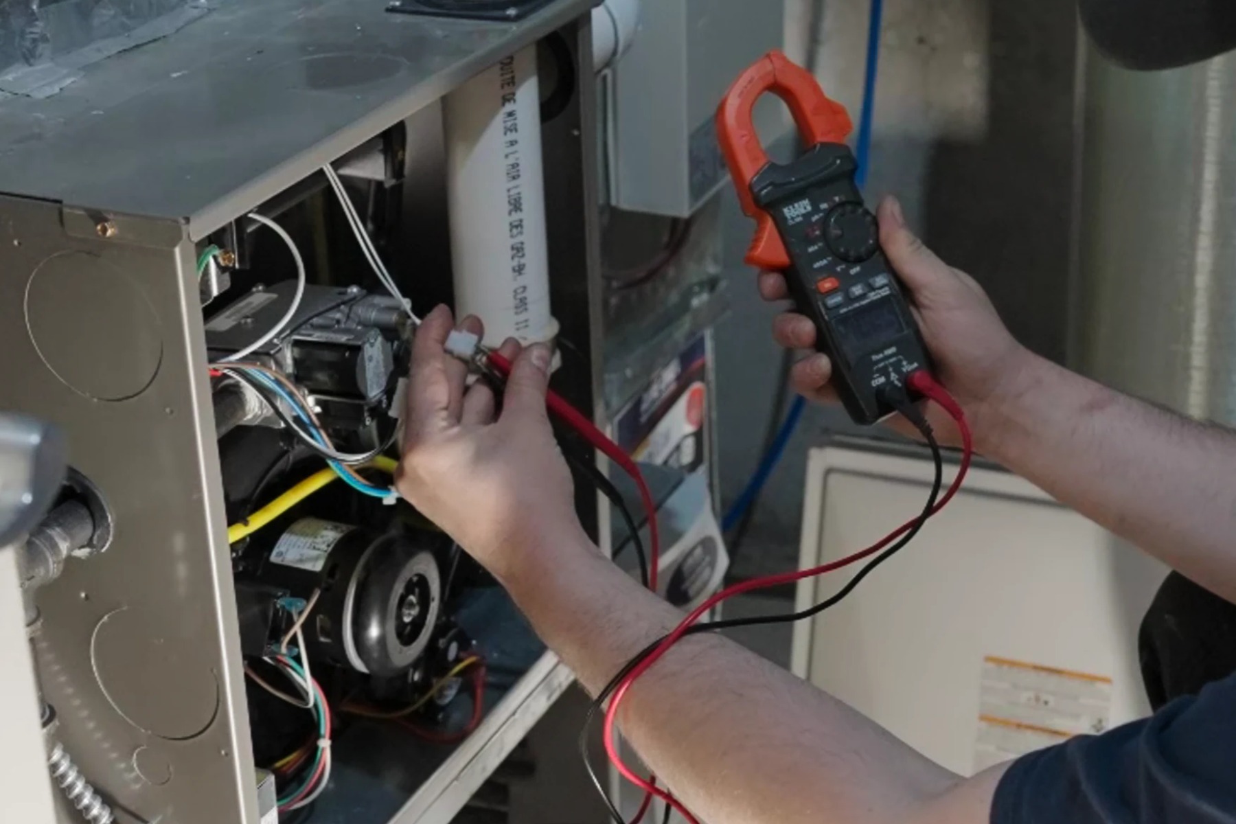 Furnace repair technician servicing a home heating system in London, Ontario