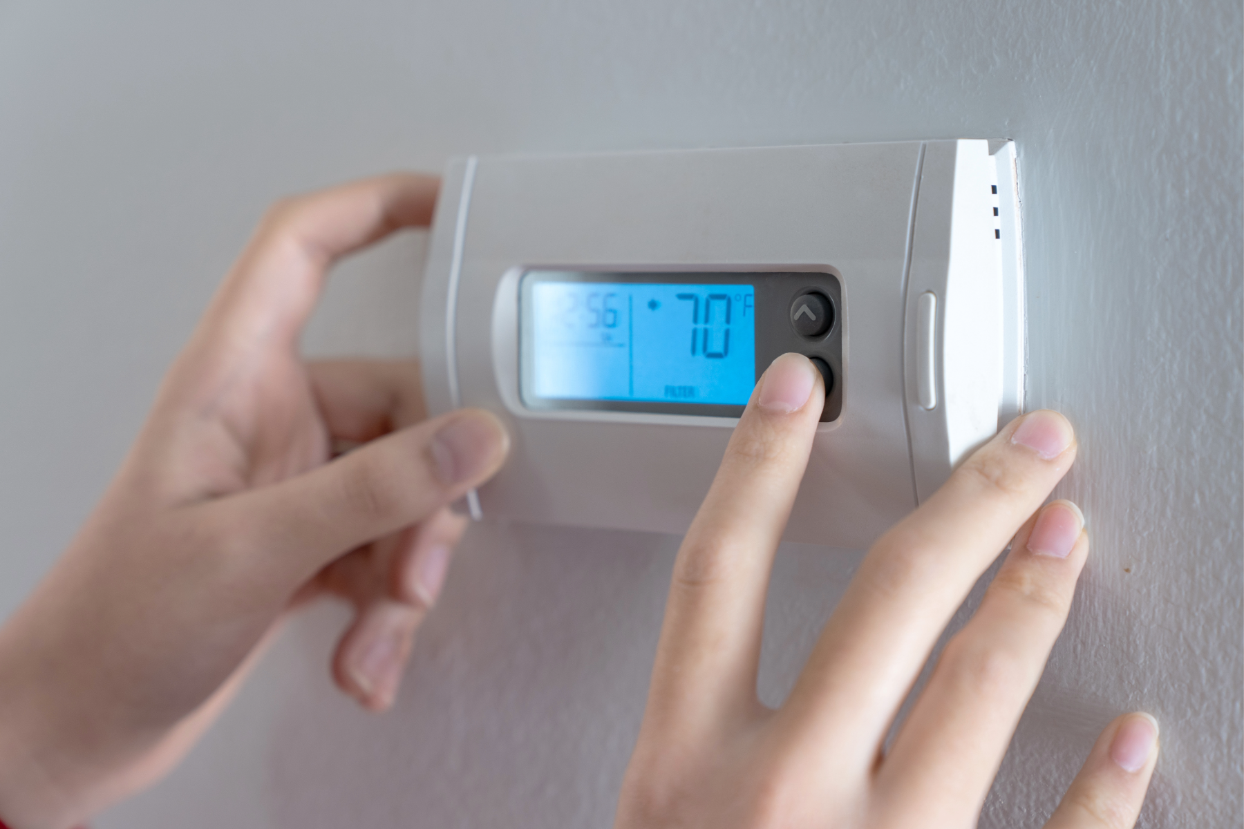 Smart thermostat mounted on a wall in a London, Ontario home
